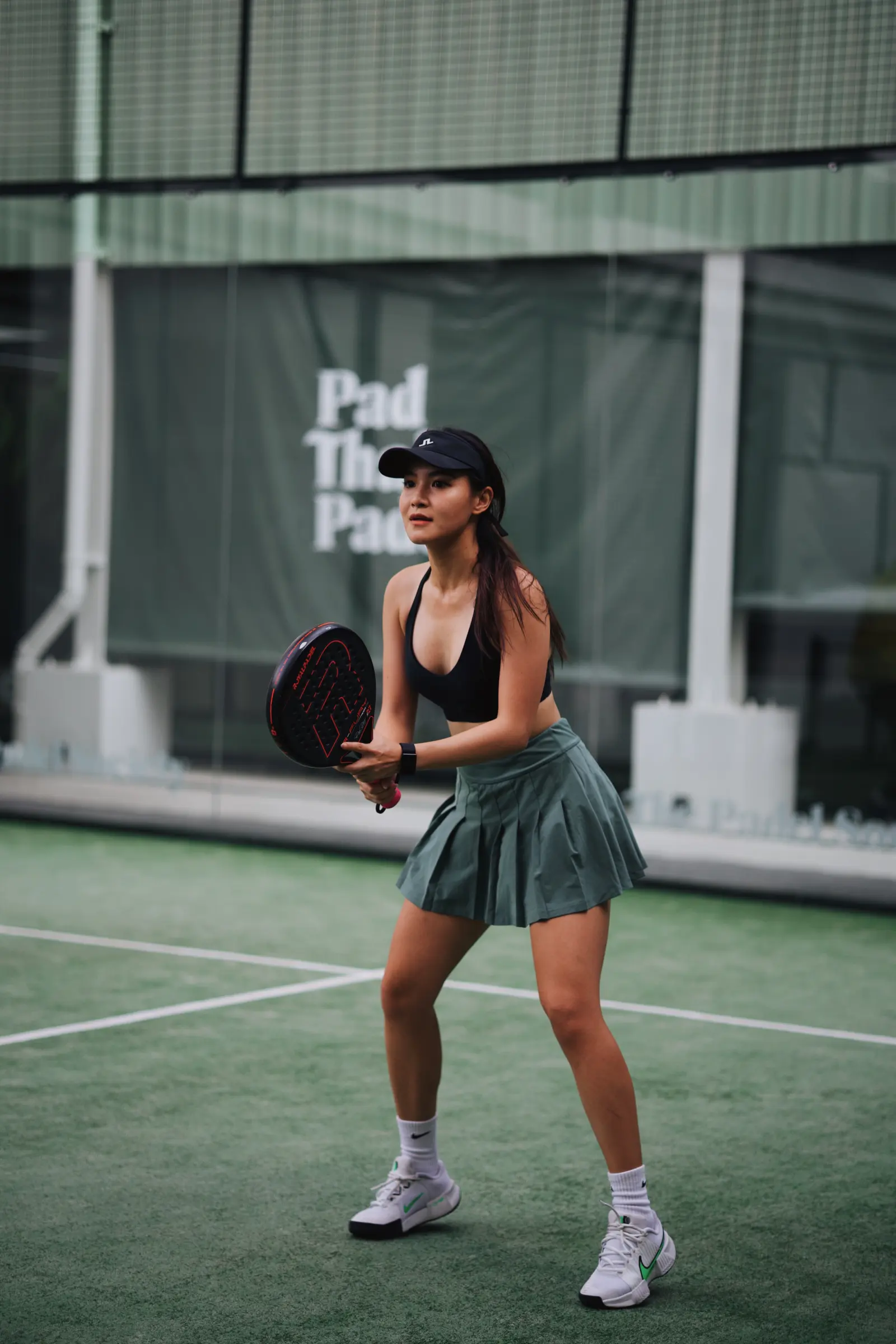 Player at Pad Thai Padel courtside